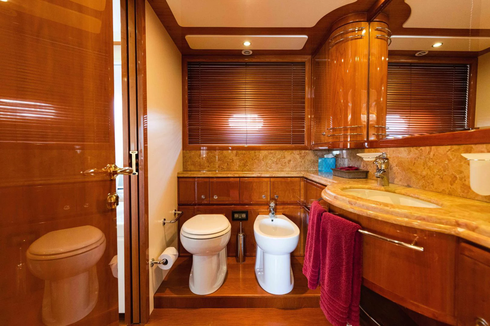 a bathroom with a toilet and sink aboard KAVITA Yacht for Sale