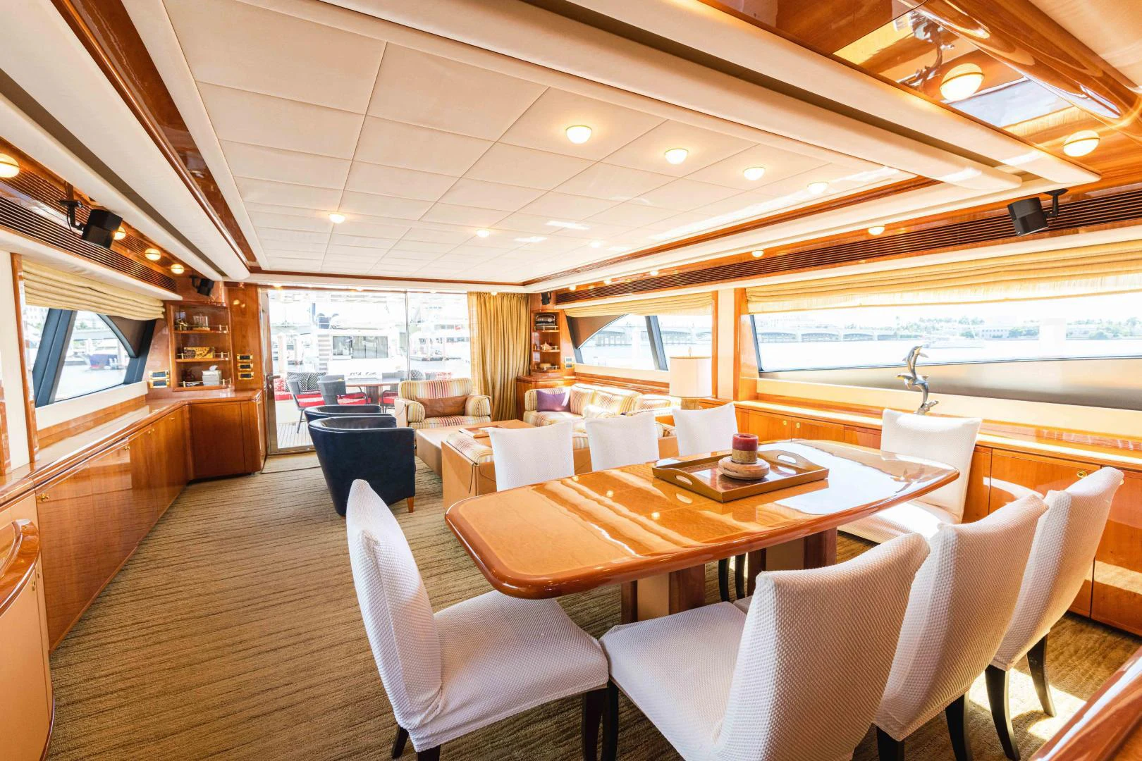 a large room with a table and chairs aboard KAVITA Yacht for Sale