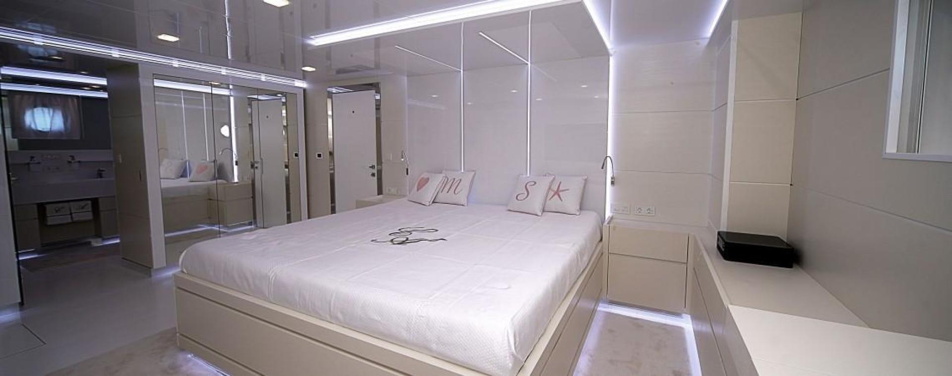 a room with a bed and a television aboard NO NAME Yacht for Sale