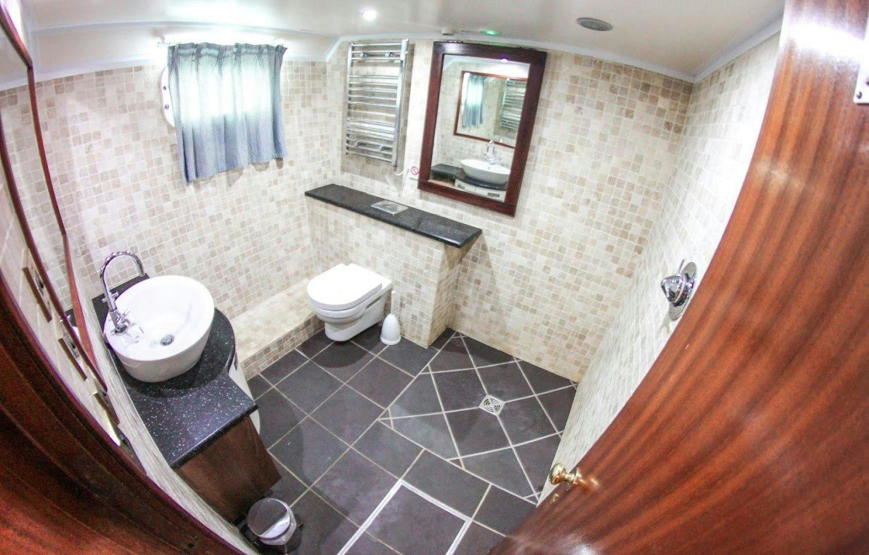a bathroom with a sink and a toilet aboard EVA Yacht for Sale