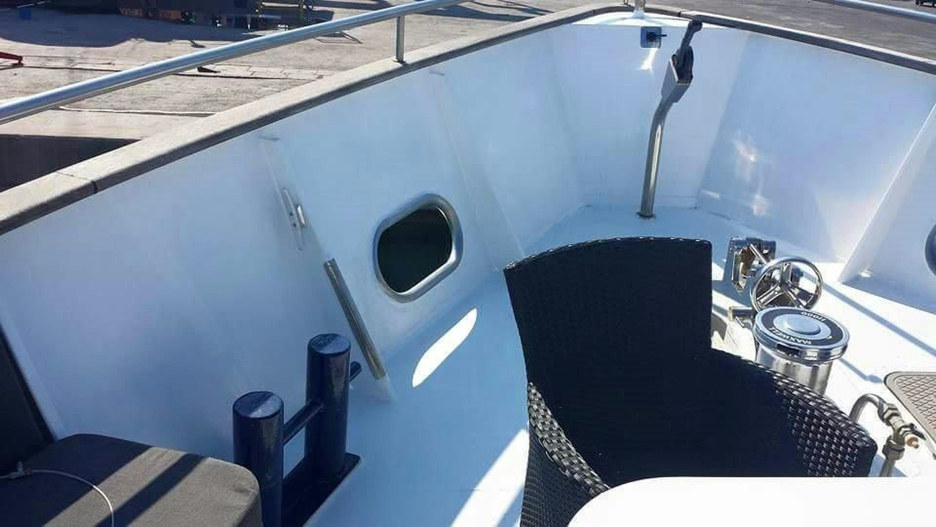 a boat with a seat aboard EVA Yacht for Sale