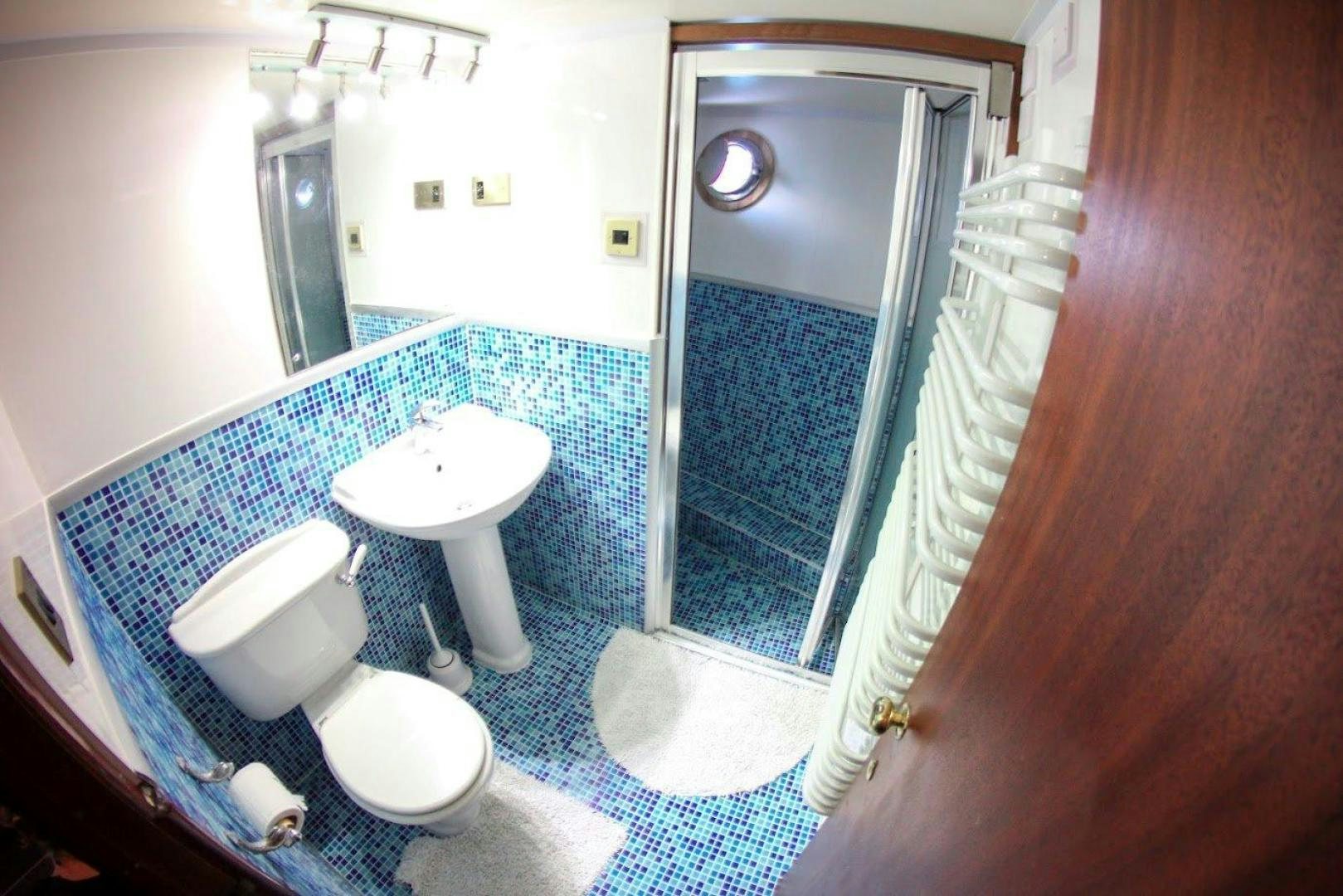 a bathroom with a sink and a toilet aboard EVA Yacht for Sale