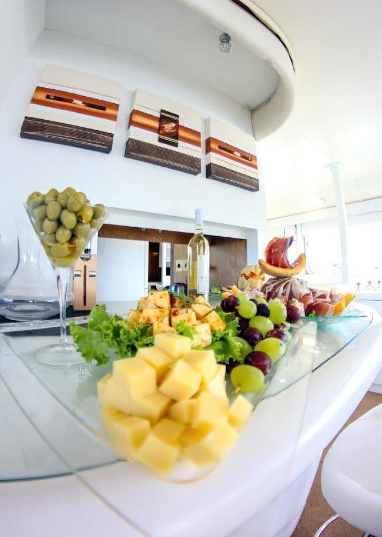 a table with food on it aboard EVA Yacht for Sale