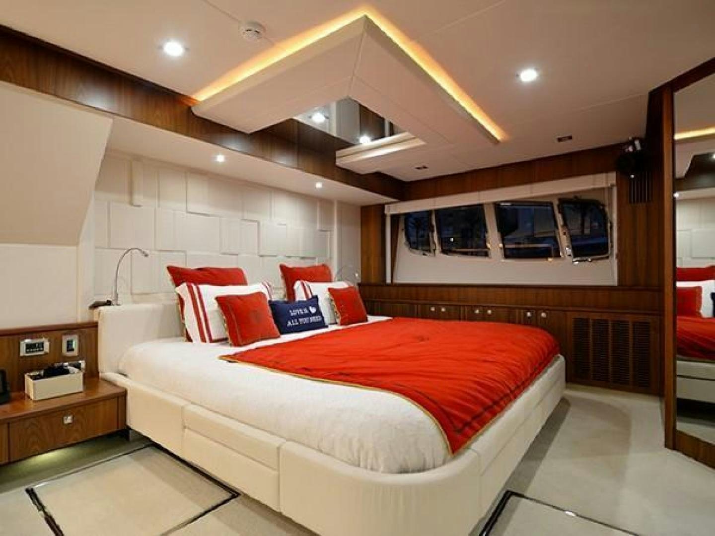 a bedroom with a bed and a desk aboard EXIMIUS Yacht for Sale