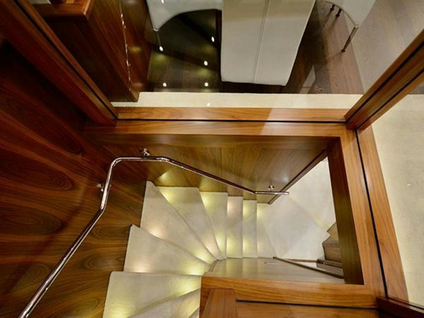 a spiral staircase with a railing aboard EXIMIUS Yacht for Sale