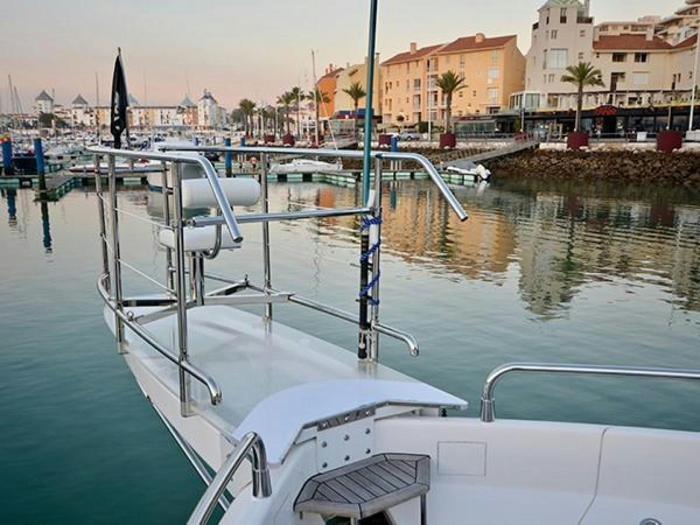 a boat in a harbor aboard EXIMIUS Yacht for Sale