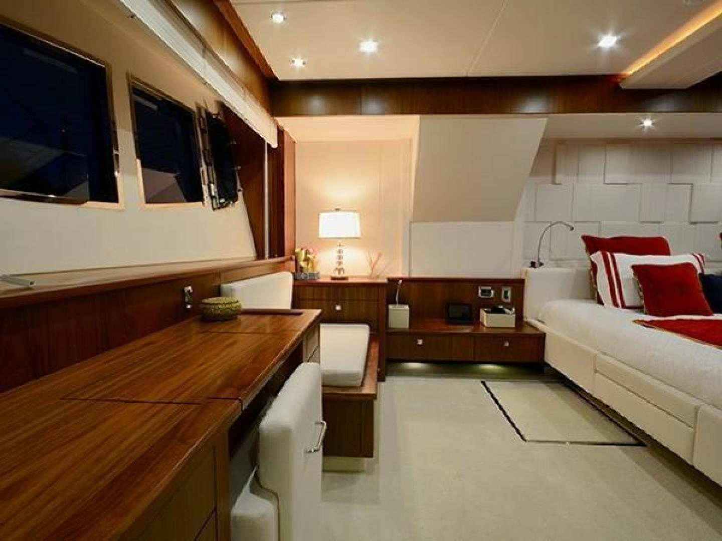 a room with a bed and a desk aboard EXIMIUS Yacht for Sale