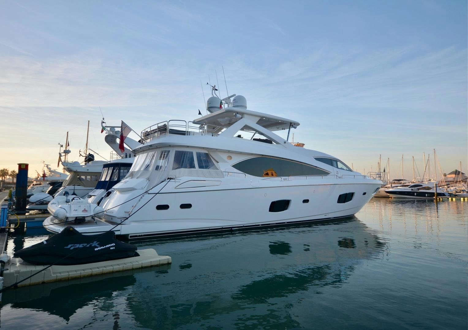 a group of boats in a harbor aboard EXIMIUS Yacht for Sale