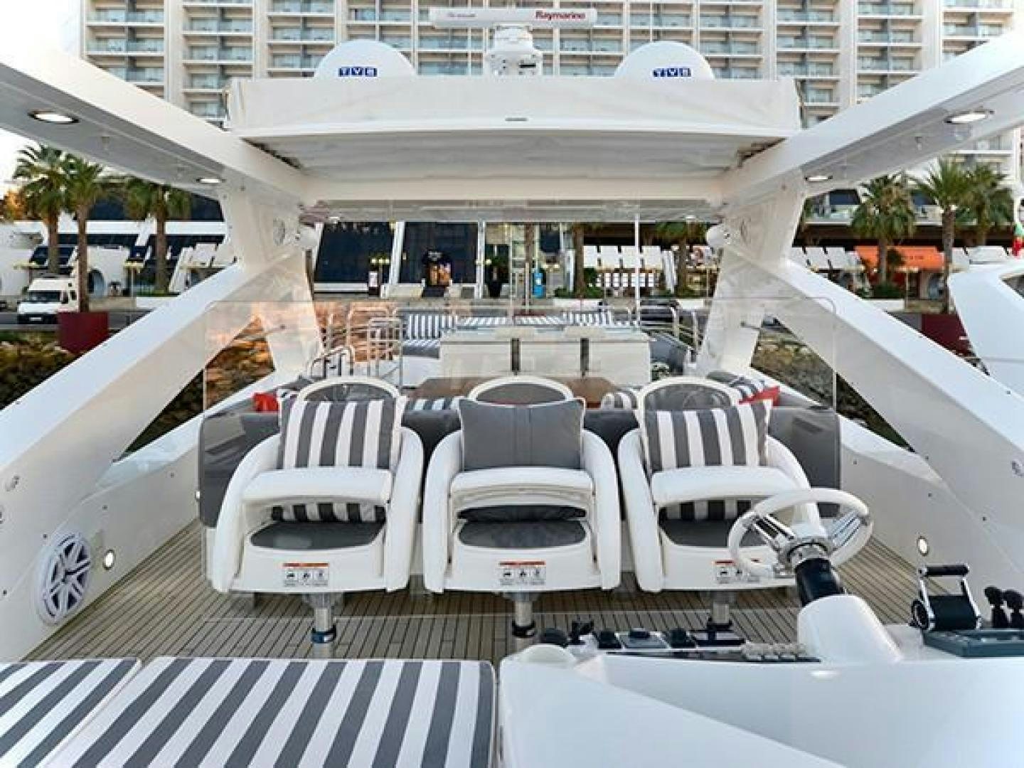 a group of chairs on a deck aboard EXIMIUS Yacht for Sale