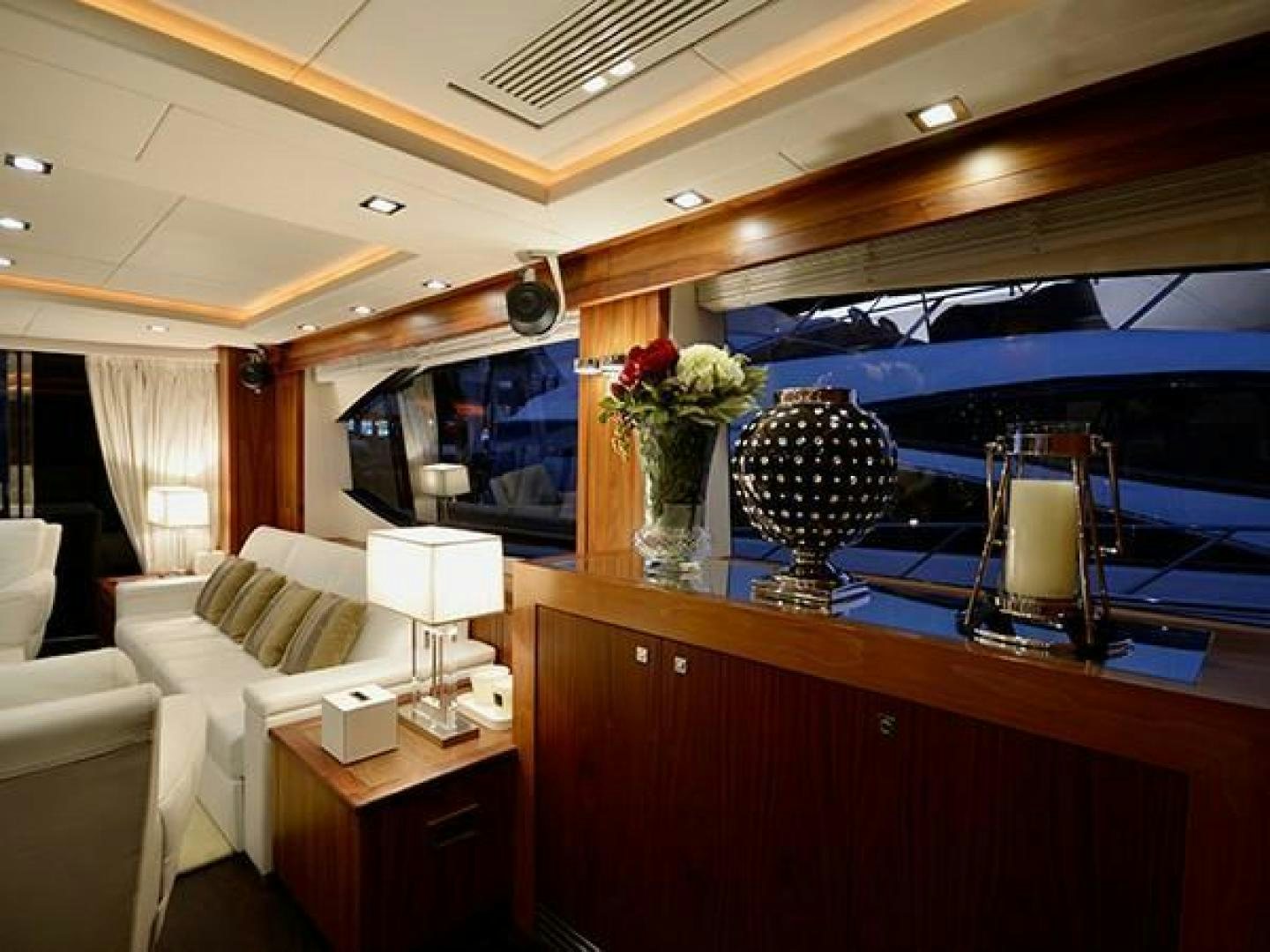 a living room with a large mirror aboard EXIMIUS Yacht for Sale