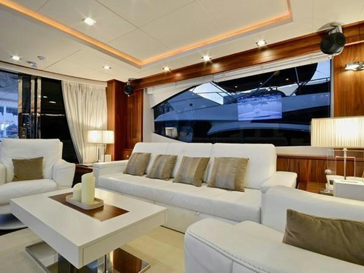 a living room with a large screen aboard EXIMIUS Yacht for Sale