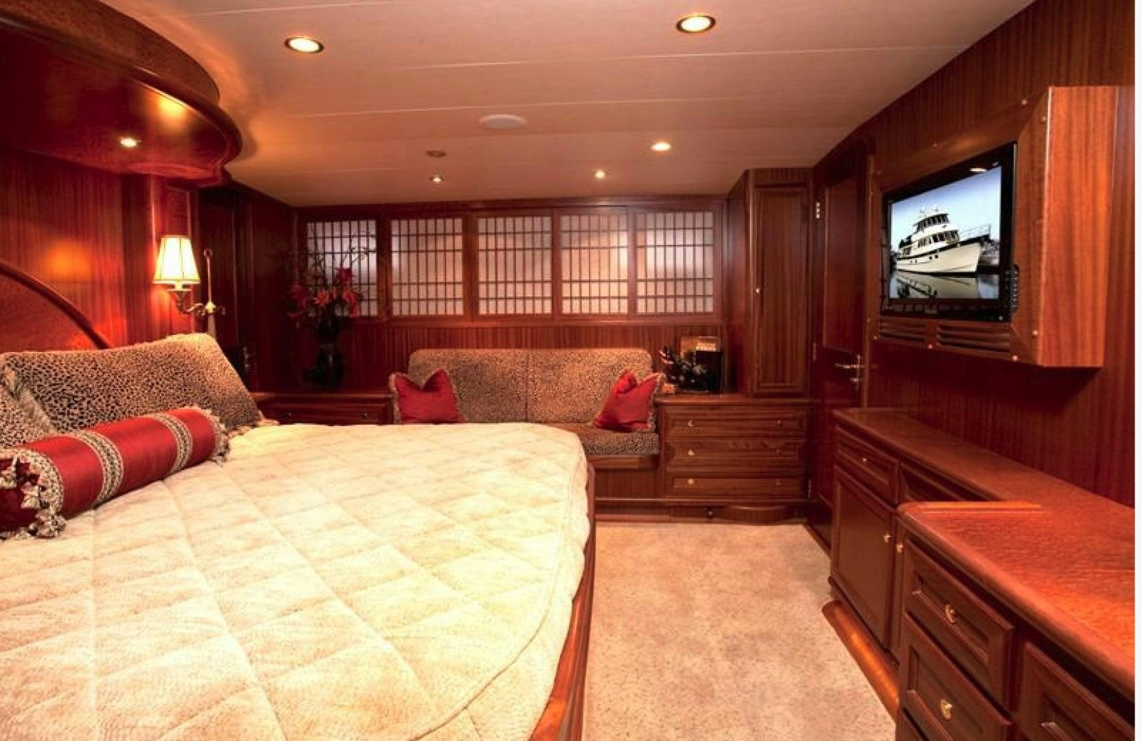a bedroom with a bed and a tv aboard NO NAME Yacht for Sale