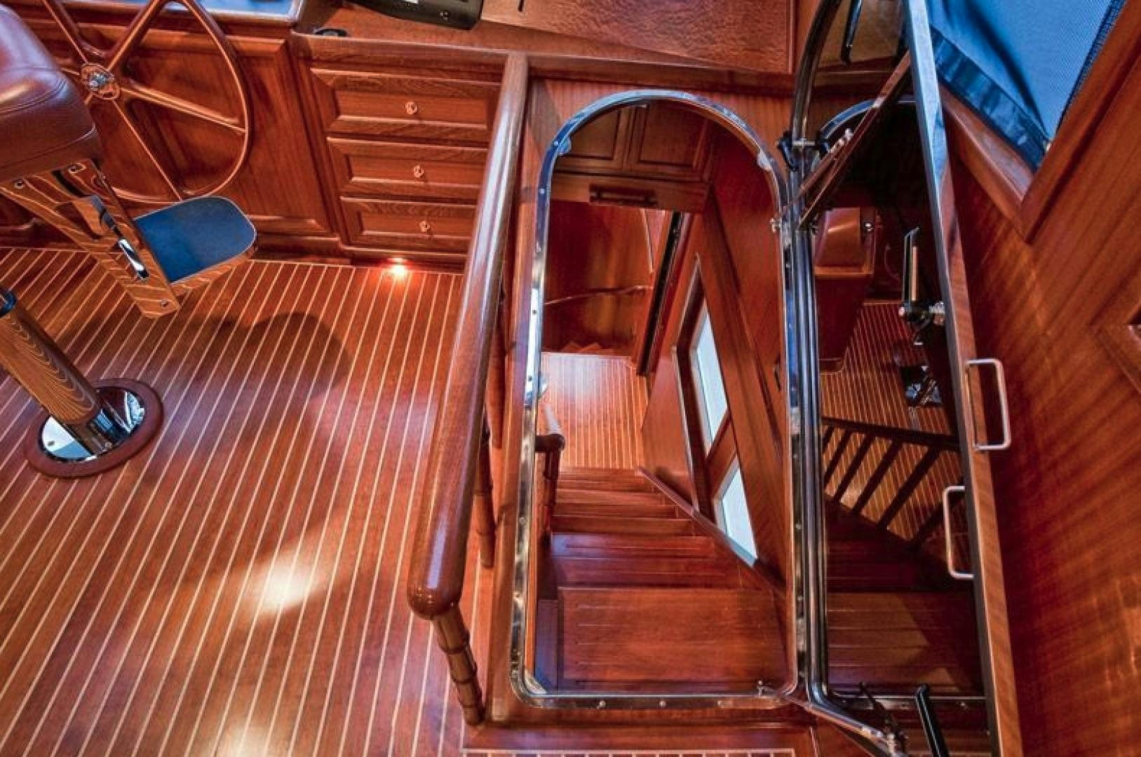 a wooden staircase with a wood railing aboard NO NAME Yacht for Sale