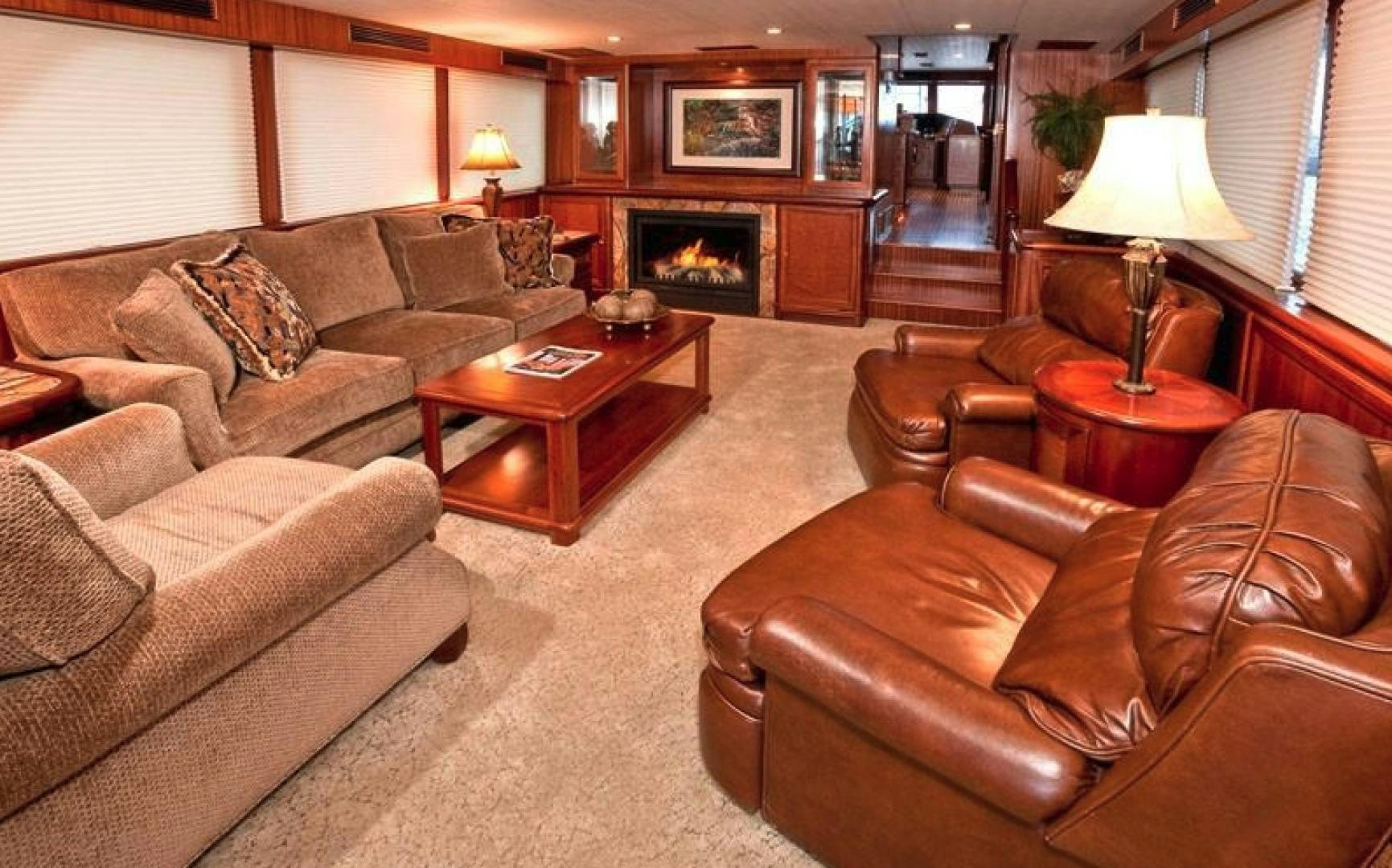 a living room with a fireplace aboard NO NAME Yacht for Sale