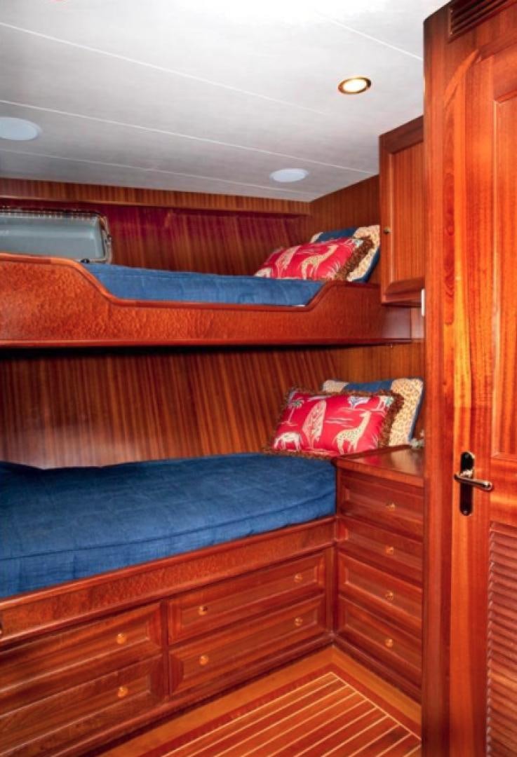 a bed with a blue sheet aboard NO NAME Yacht for Sale