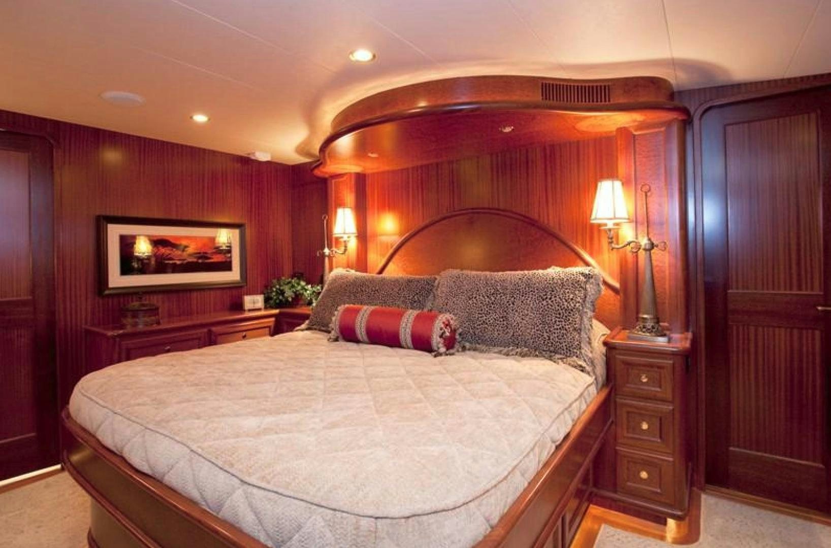 a bedroom with a bed and a dresser aboard NO NAME Yacht for Sale