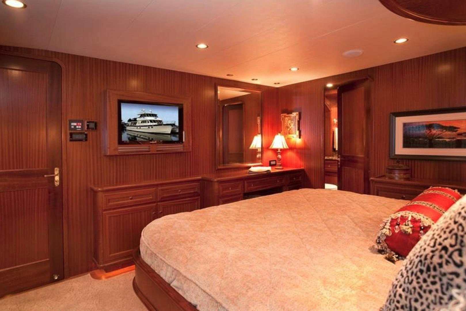 a hotel room with a bed and tv aboard NO NAME Yacht for Sale