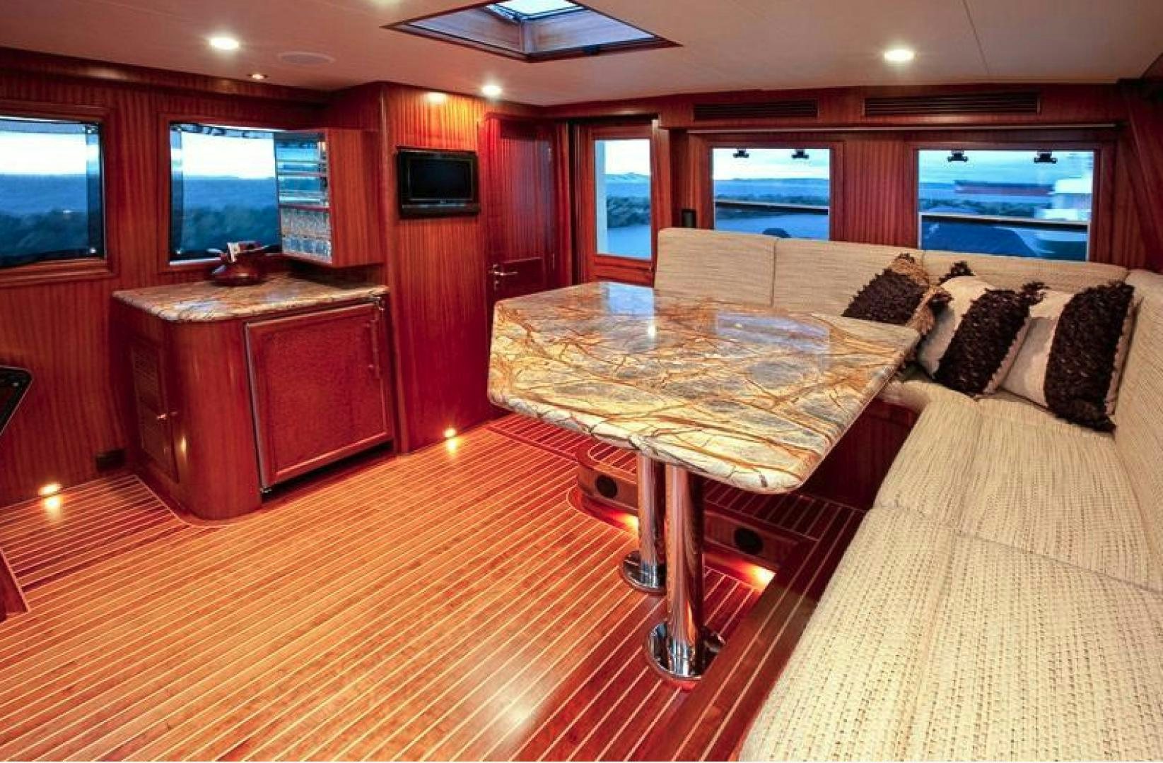 a room with a table and couches aboard NO NAME Yacht for Sale