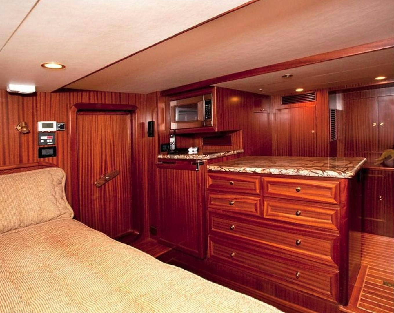 a kitchen with wooden cabinets aboard NO NAME Yacht for Sale
