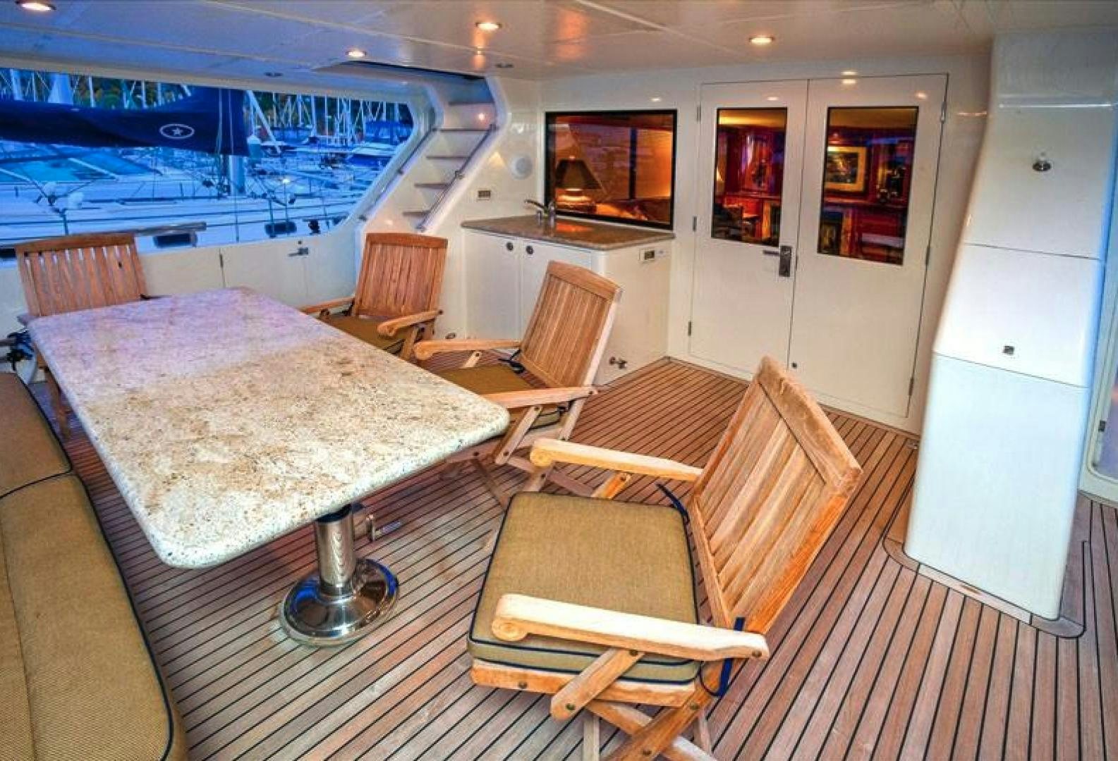 a bedroom with a bed and a chair aboard NO NAME Yacht for Sale