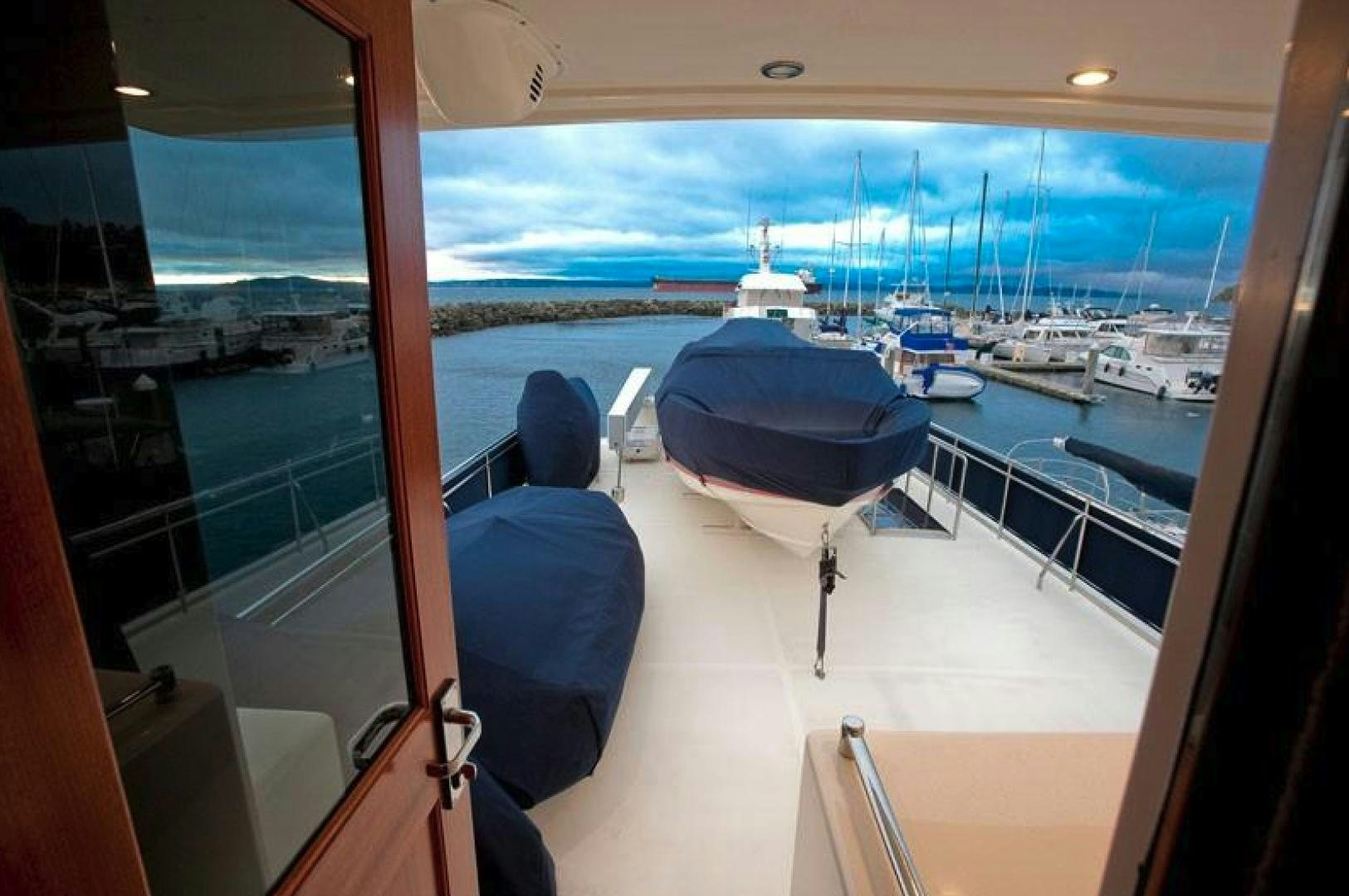 a room with a view of the water and boats aboard NO NAME Yacht for Sale