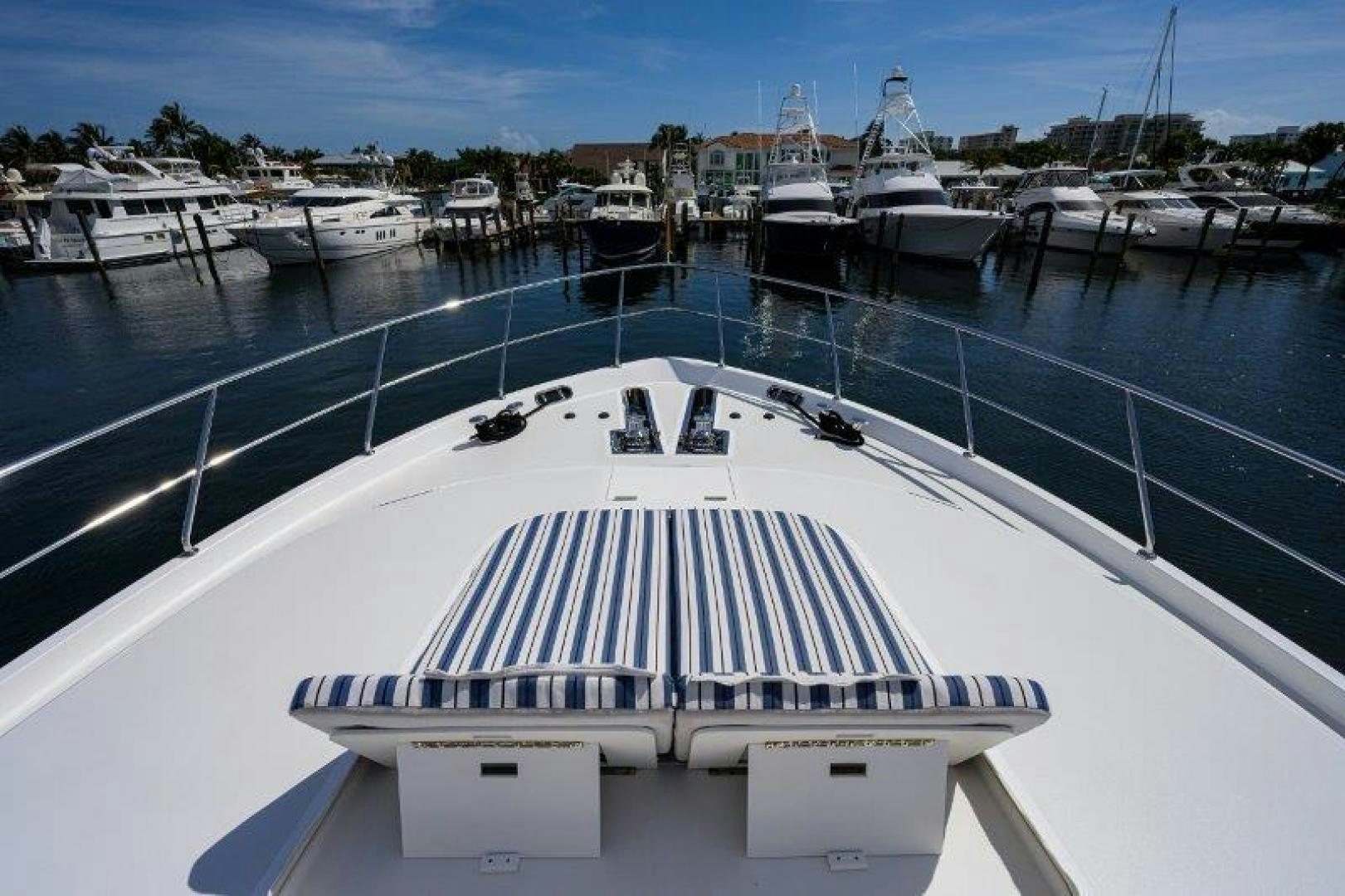a large pool with a deck and boats in it aboard AMAZING GRACE Yacht for Sale