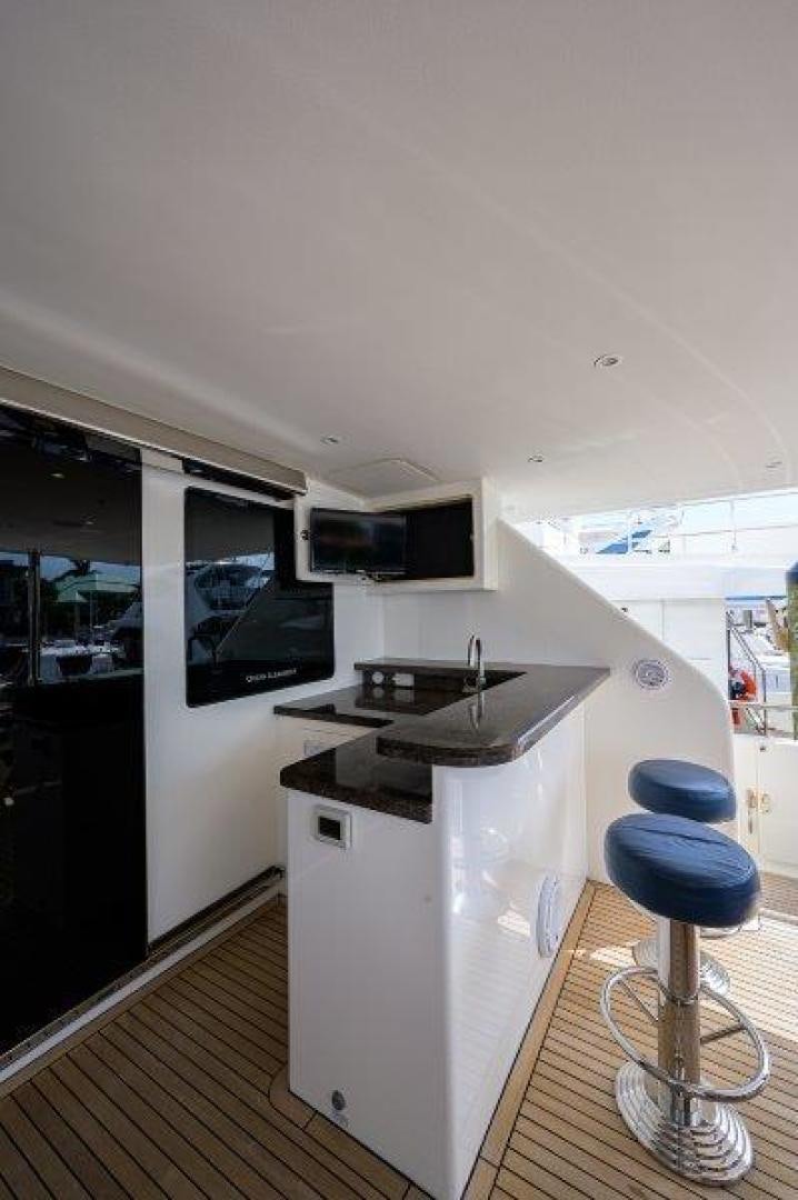 a kitchen with a stool aboard AMAZING GRACE Yacht for Sale