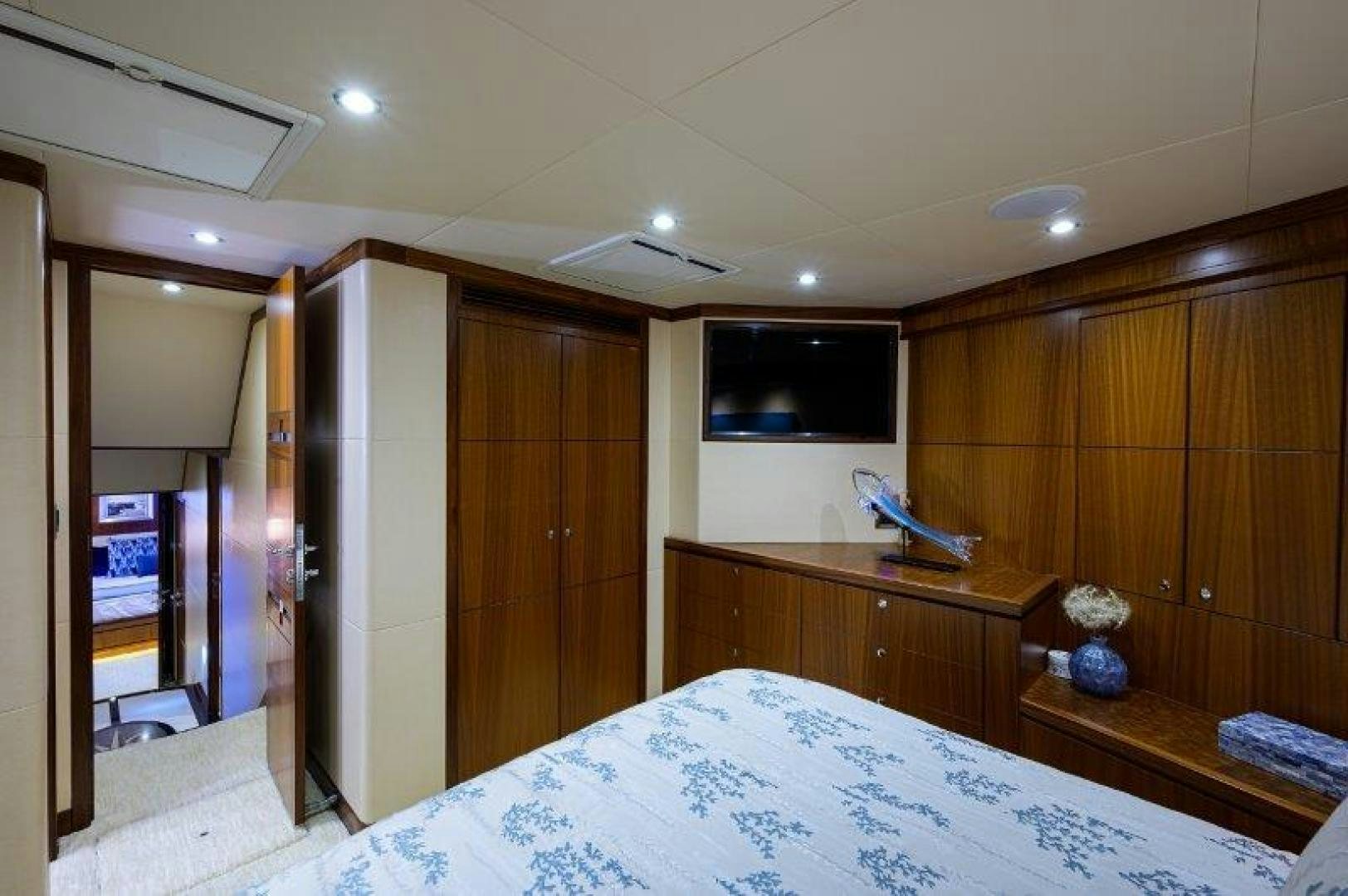 a room with a bed and a desk aboard AMAZING GRACE Yacht for Sale