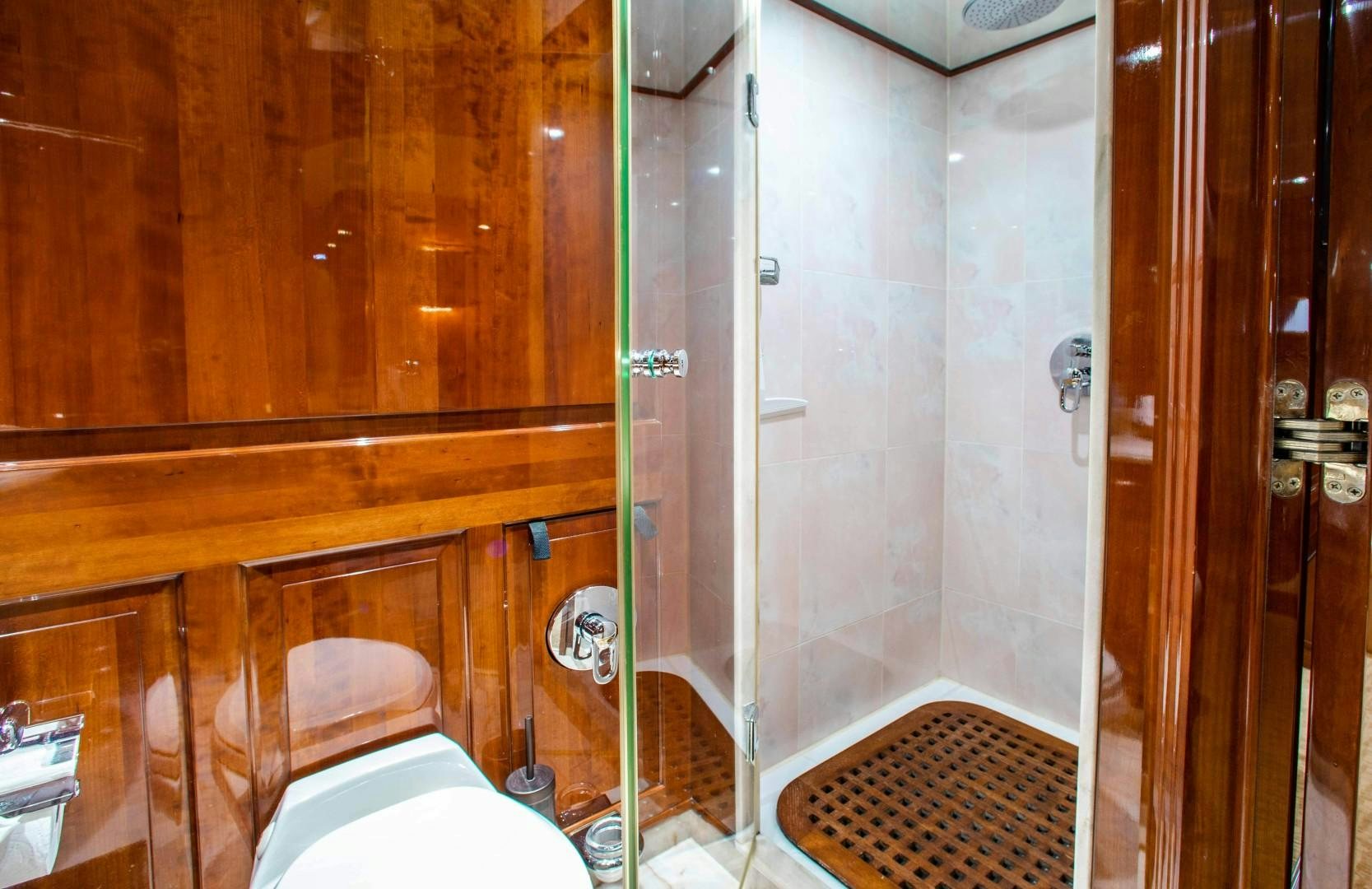 a bathroom with a glass shower aboard DRIVEN Yacht for Sale