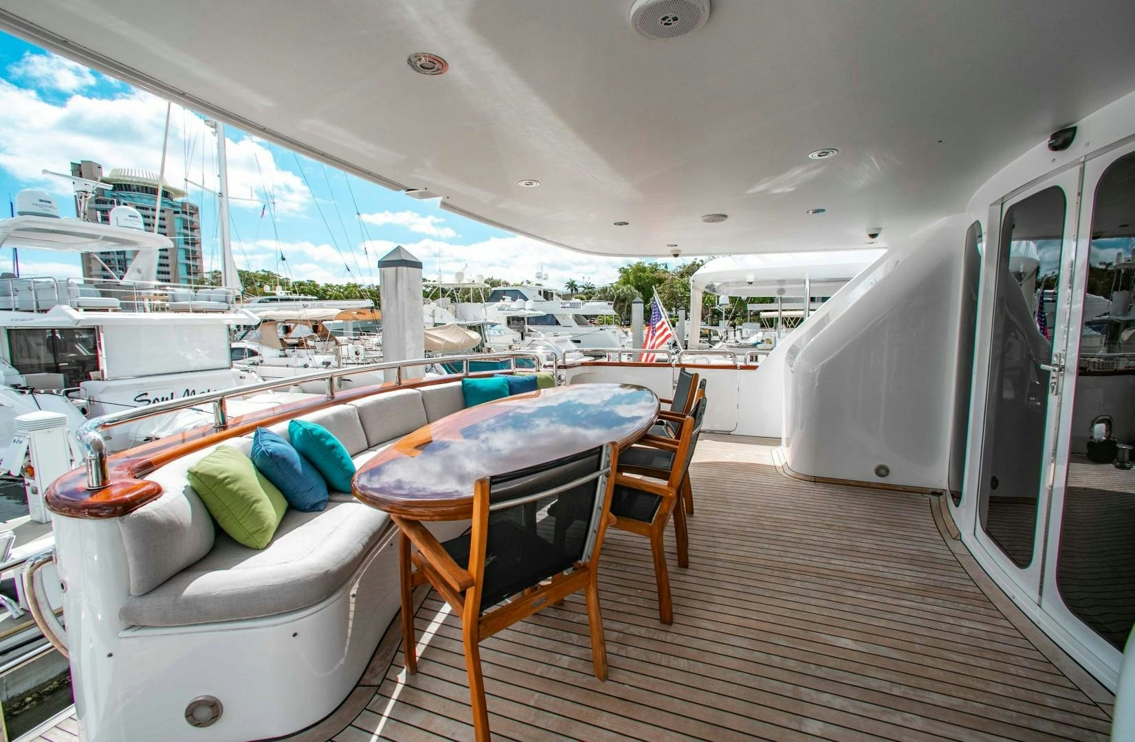 a room with a table and chairs aboard DRIVEN Yacht for Sale