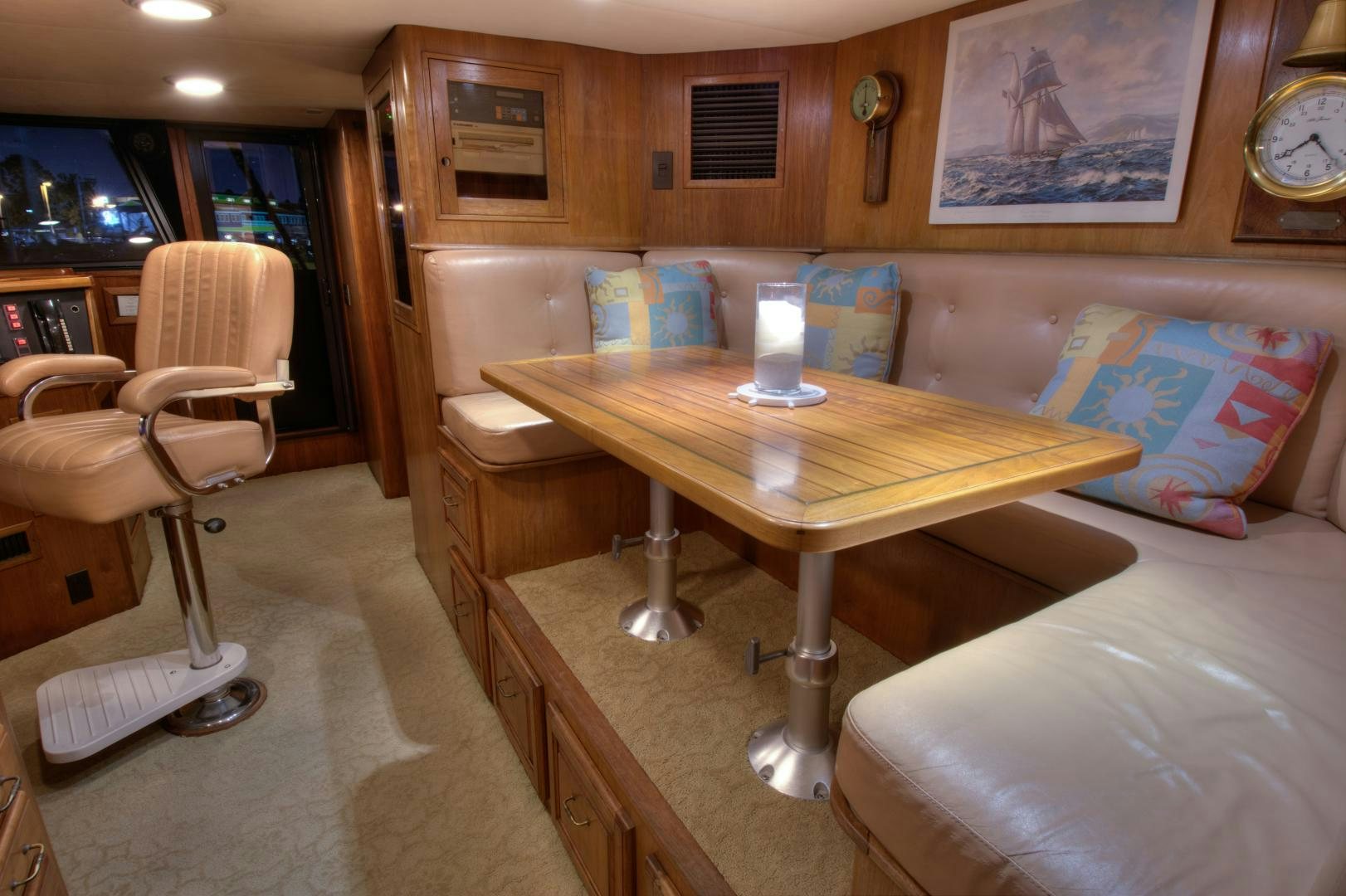 a room with a table and chairs aboard WHISKEY DAWN Yacht for Sale