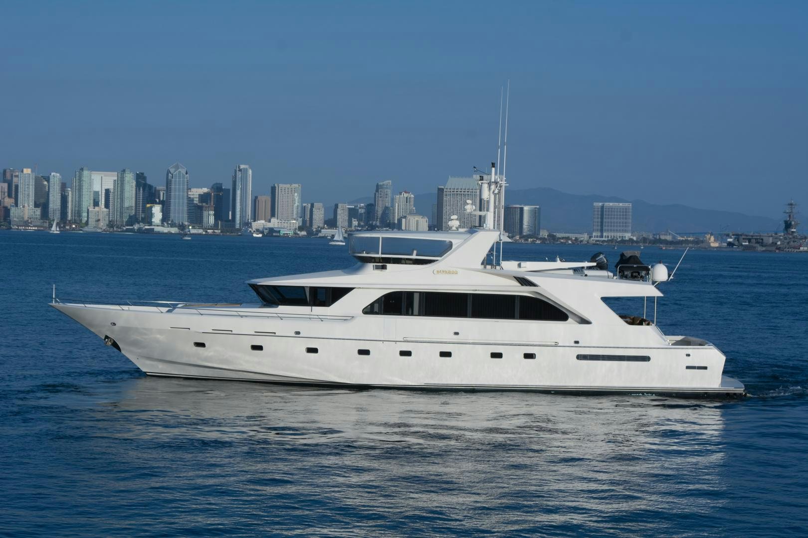 a white yacht in the water aboard WHISKEY DAWN Yacht for Sale