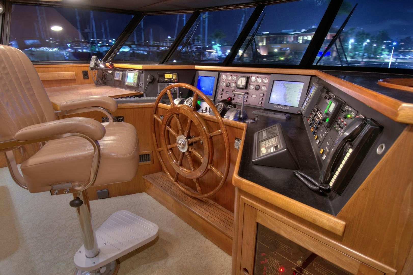 a room with a large wooden wheel aboard WHISKEY DAWN Yacht for Sale