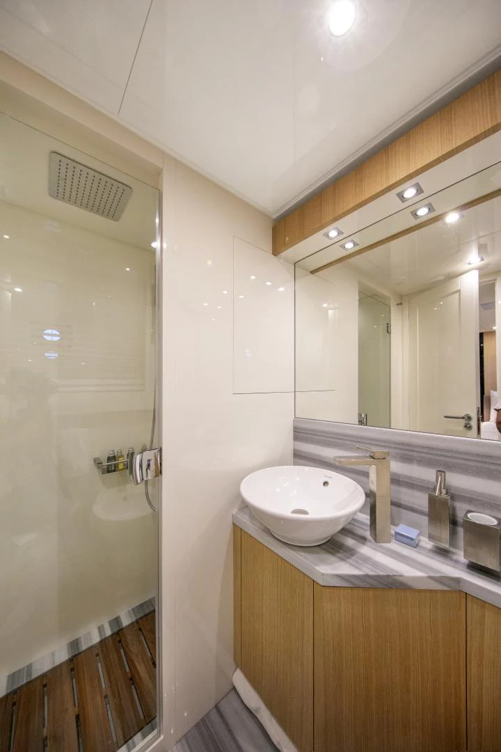 a bathroom with a sink and a mirror aboard URSUS V Yacht for Sale