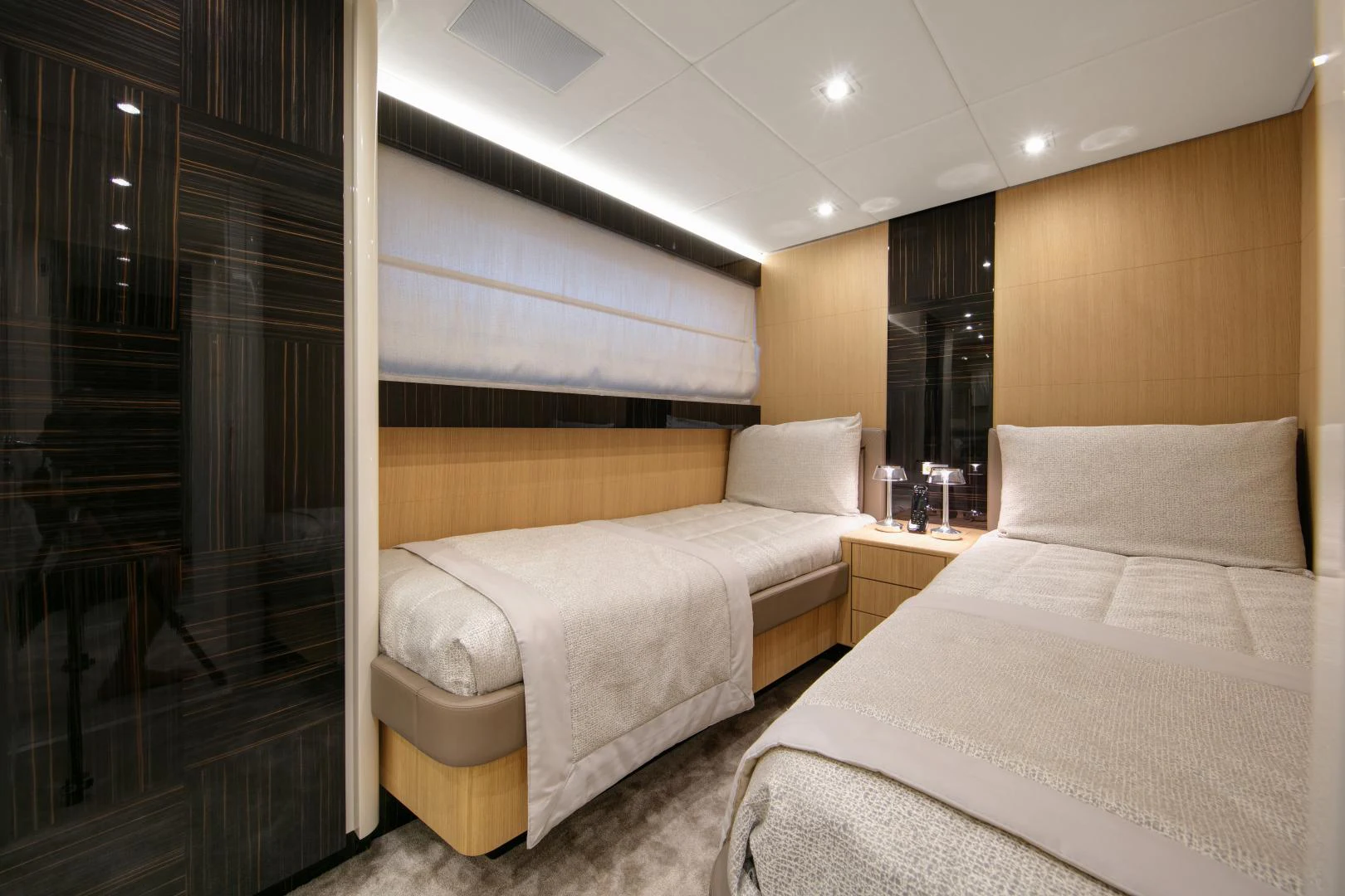 a room with two beds aboard URSUS V Yacht for Sale