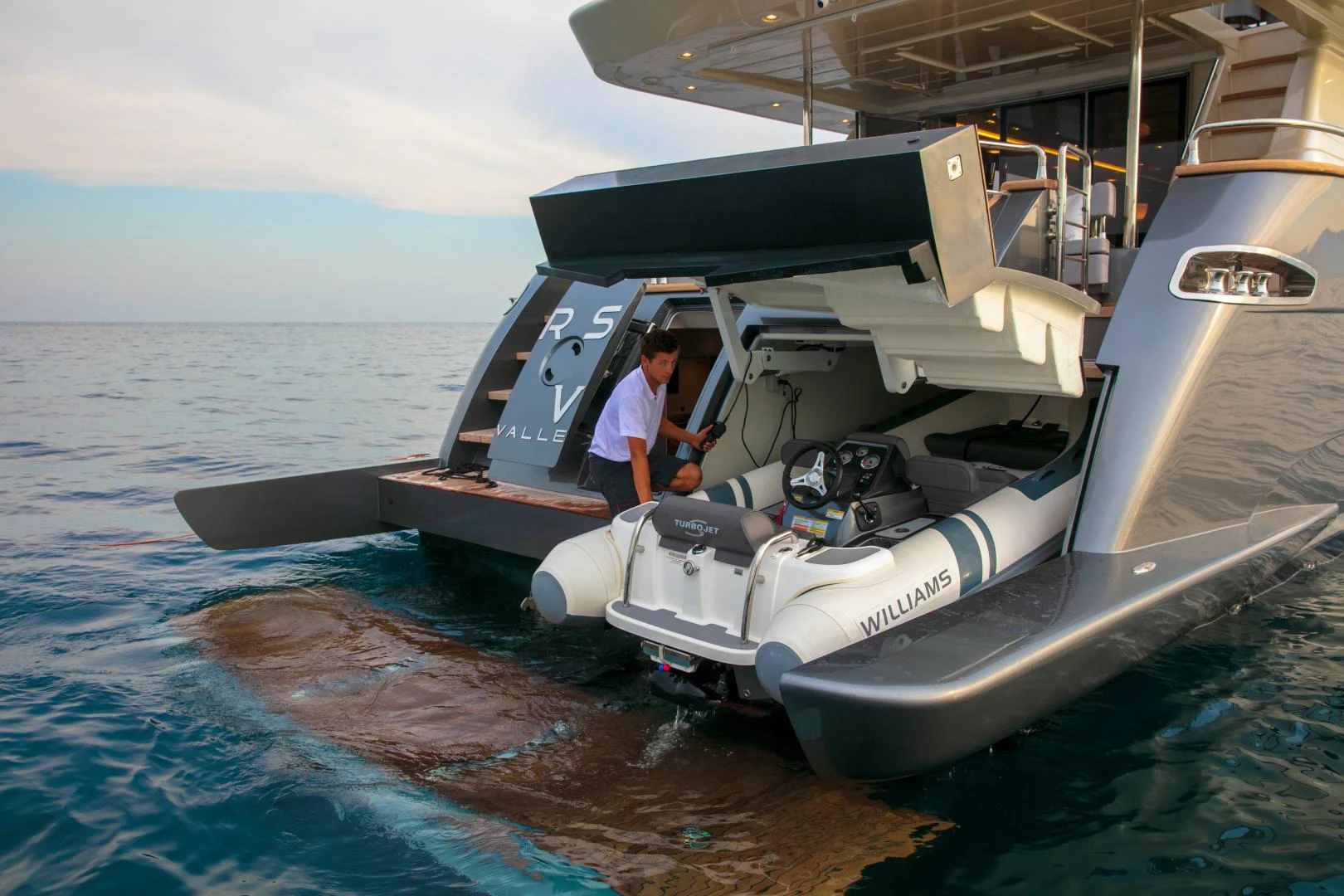 a person standing on a submarine aboard URSUS V Yacht for Sale