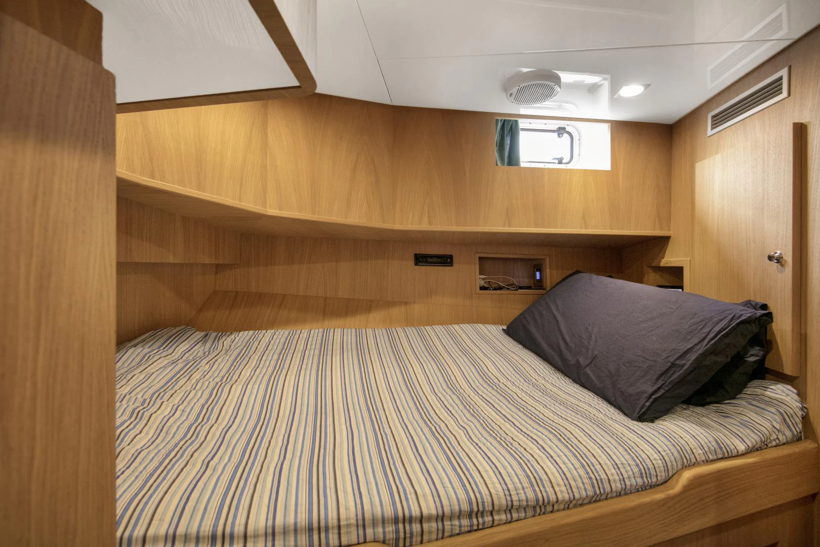 a bed in a room aboard URSUS V Yacht for Sale