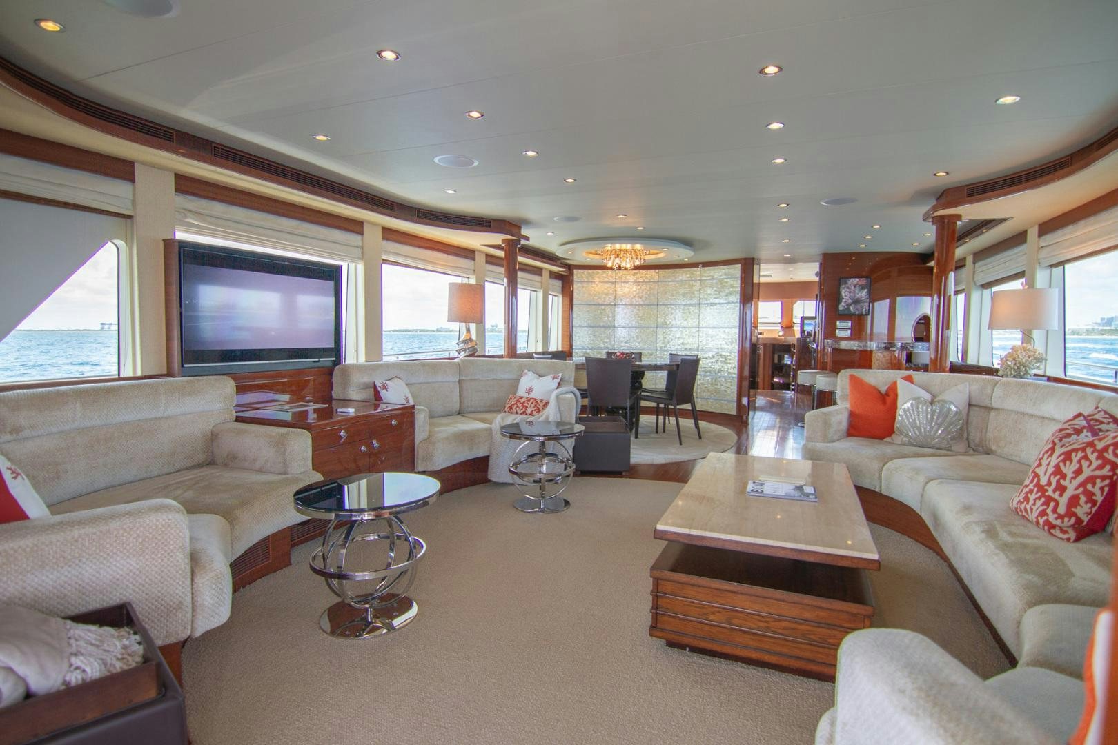 a living room with a large screen aboard BRAVO Yacht for Sale