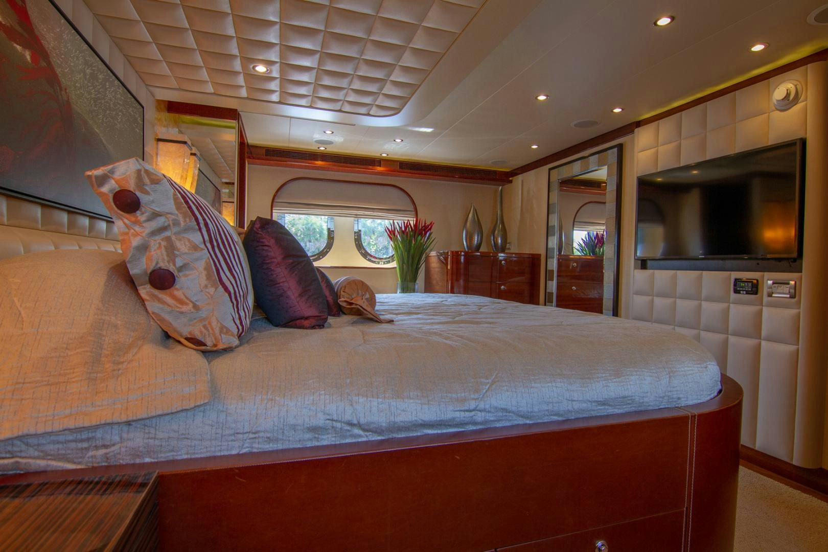 a bed with a pillow on it aboard BRAVO Yacht for Sale
