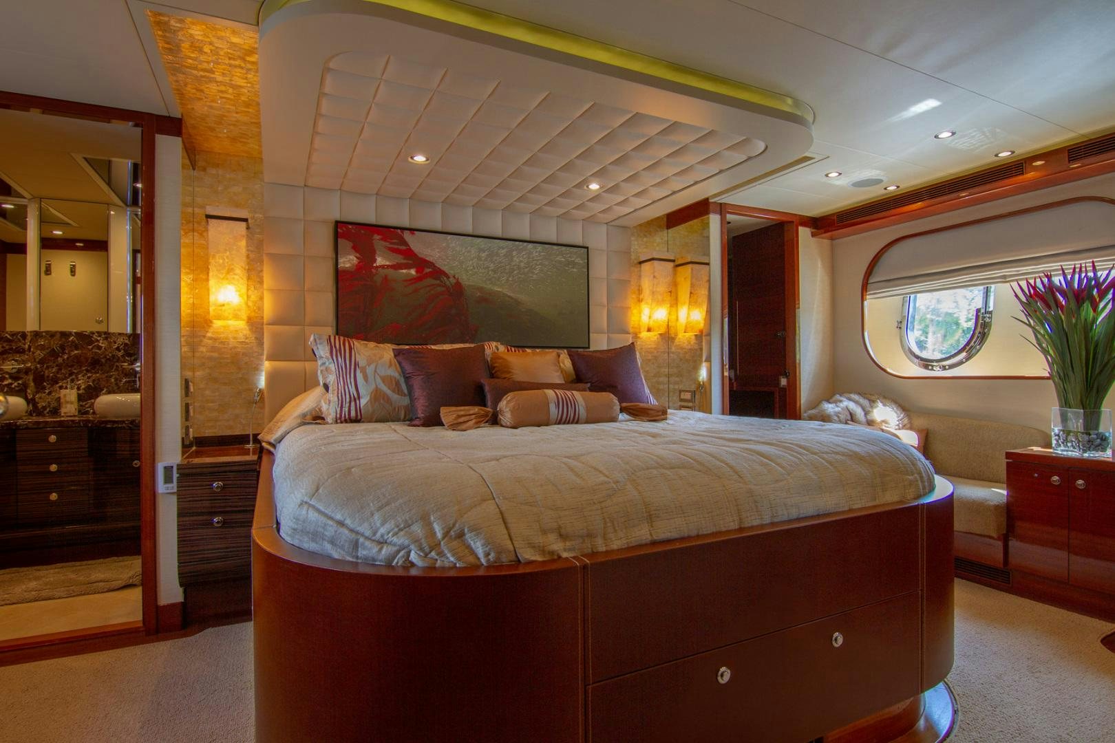 a bed in a room aboard BRAVO Yacht for Sale