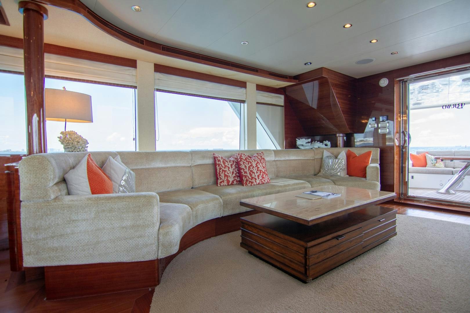 a living room with a couch and a coffee table aboard BRAVO Yacht for Sale