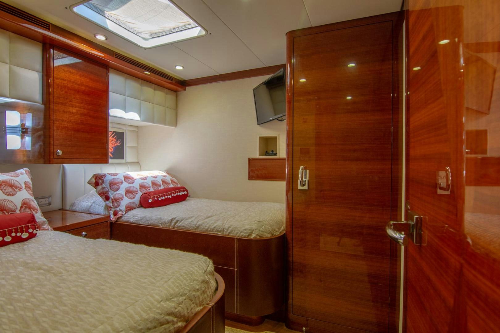 a room with a bed and a closet aboard BRAVO Yacht for Sale