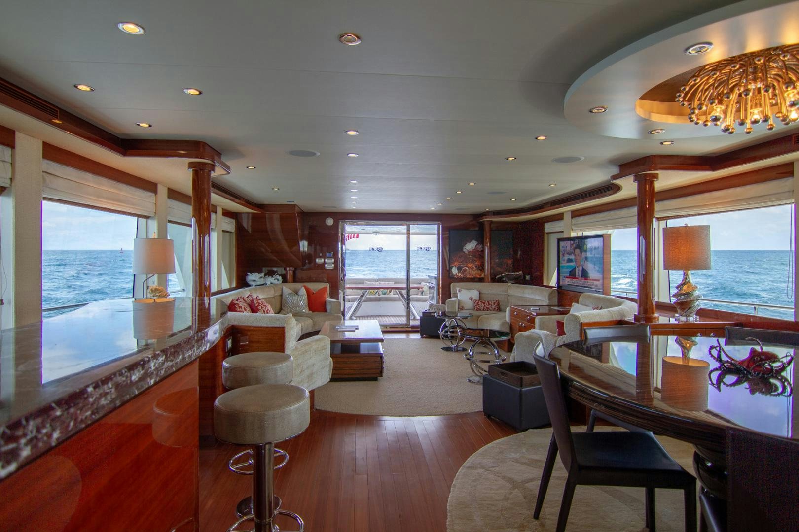 a living room with a large window aboard BRAVO Yacht for Sale