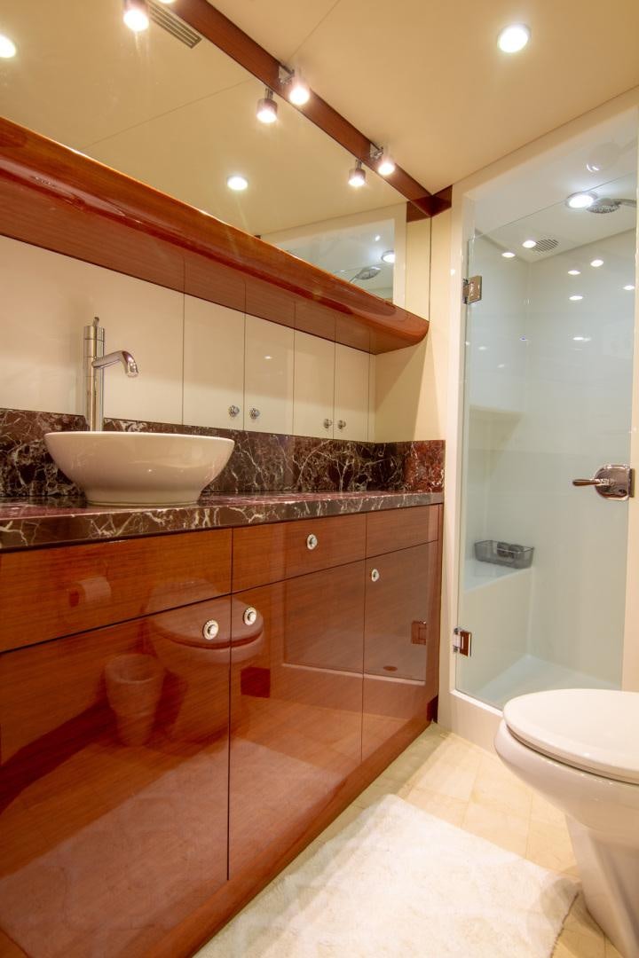a bathroom with a sink and a toilet aboard BRAVO Yacht for Sale
