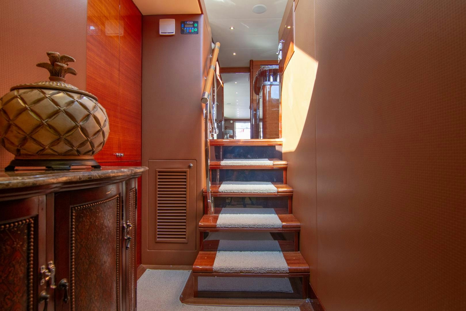 a staircase in a building aboard BRAVO Yacht for Sale