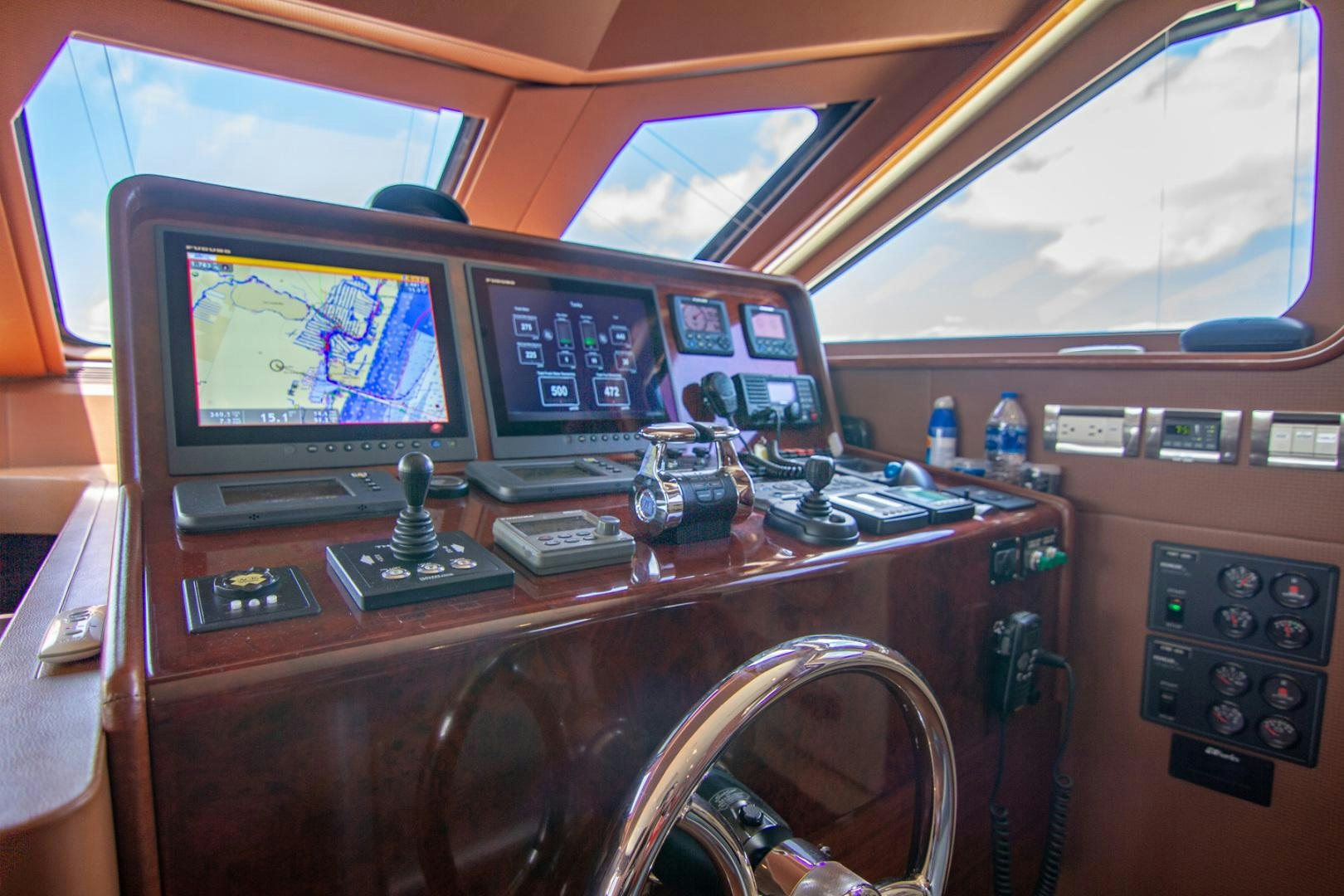 inside of a vehicle with a desk and computer aboard BRAVO Yacht for Sale