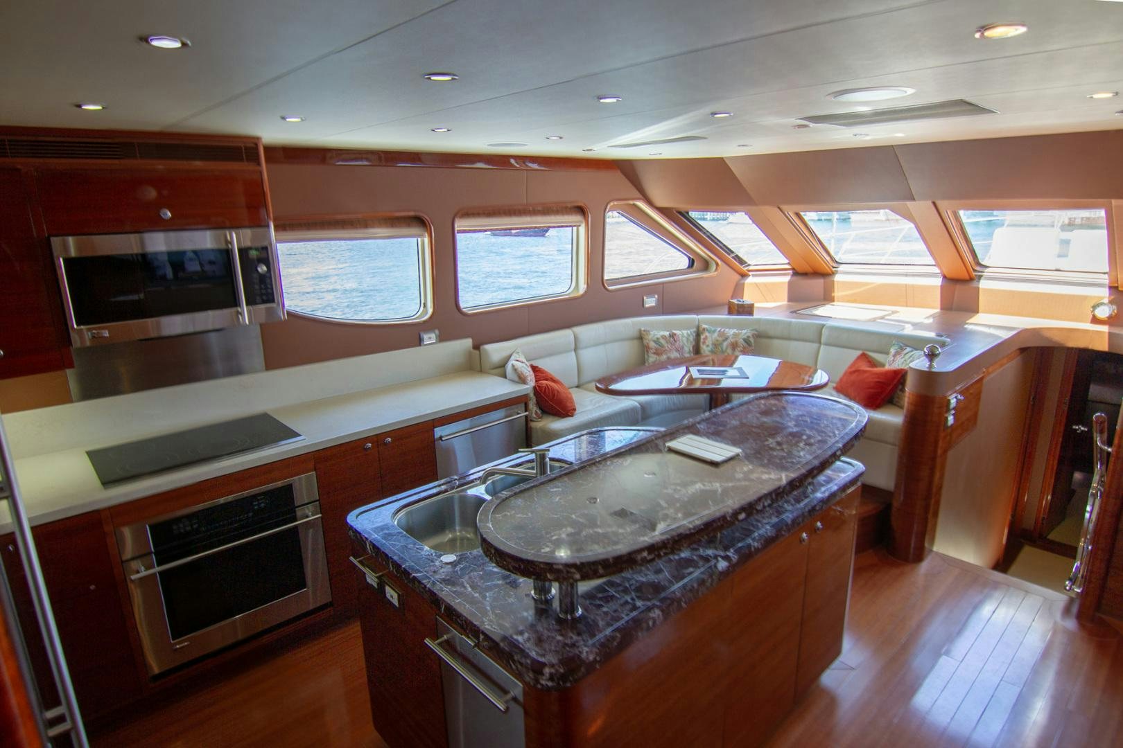 a kitchen with a large island aboard BRAVO Yacht for Sale