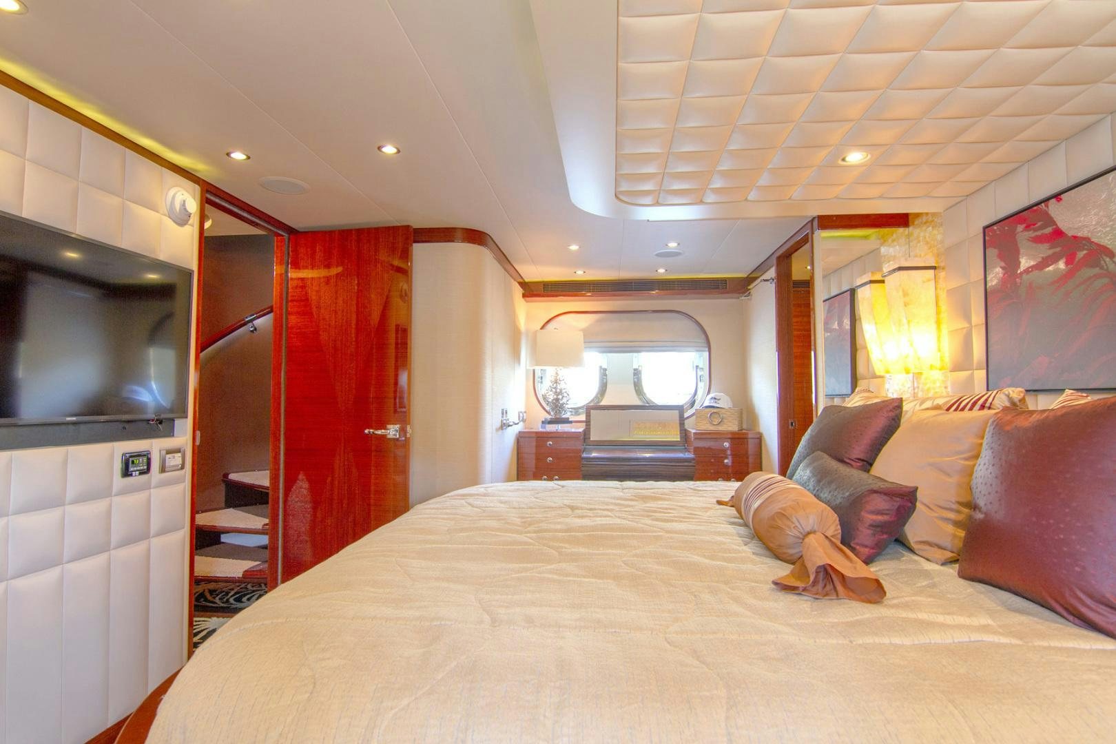 a person lying on a bed aboard BRAVO Yacht for Sale