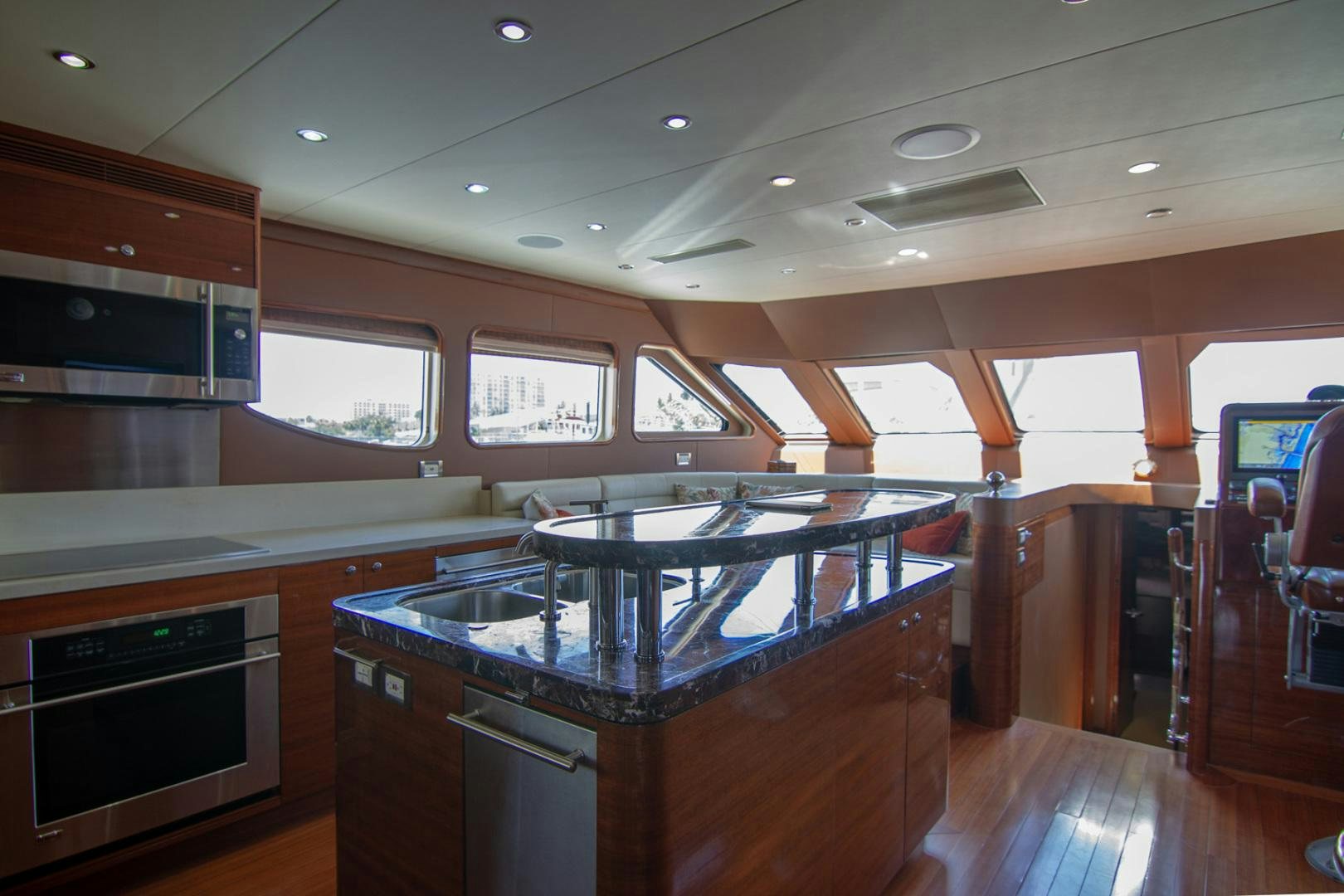 a kitchen with a large island aboard BRAVO Yacht for Sale