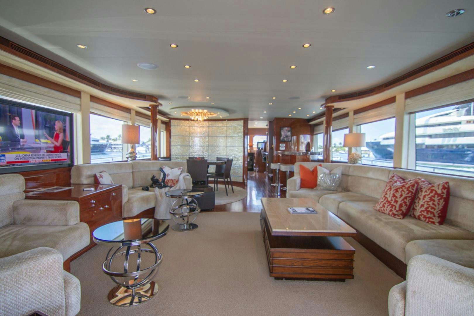 a living room with a large window aboard BRAVO Yacht for Sale